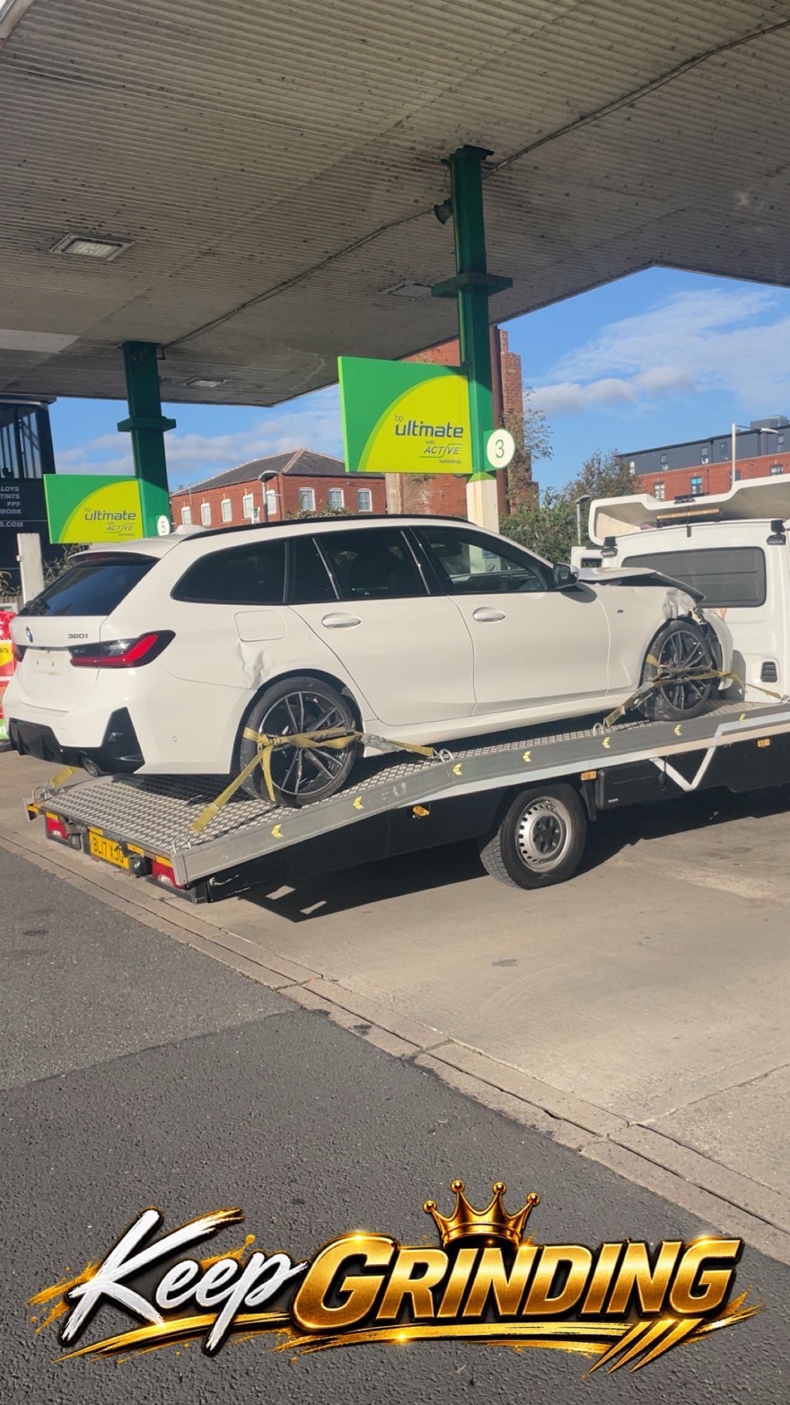 Vehicle recovery transport carrying a damaged car